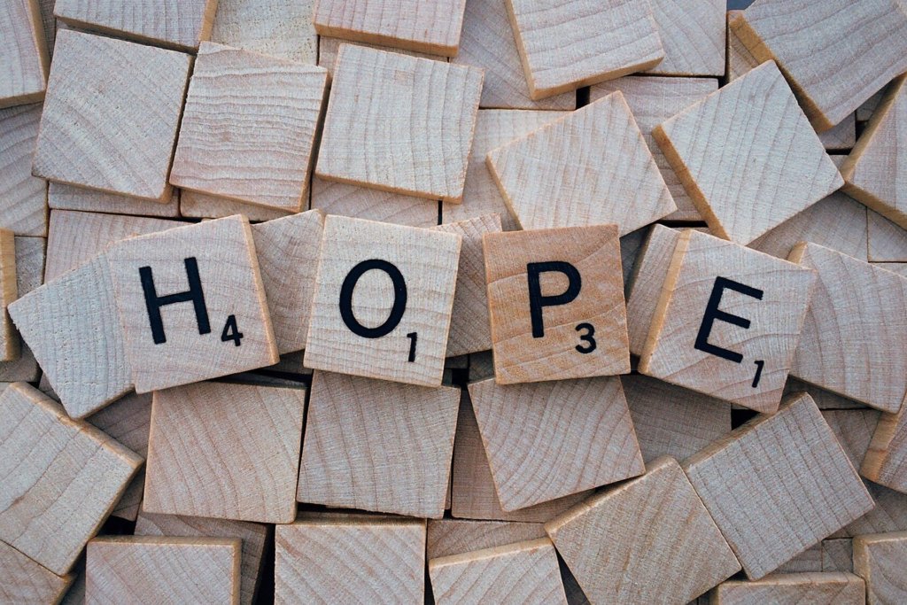 Scrabble tiles spelling the word "hope" for the anxious mother.